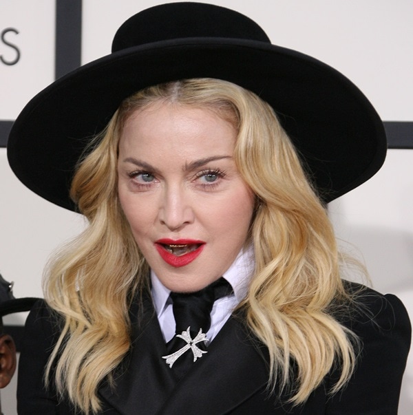 Madonna showed off her sparkling grills while answering questions on the red carpet