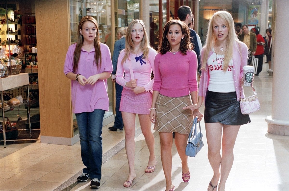 Lindsay Lohan as 16-year-old girl Cady Heron, Rachel McAdams as popular mean girl Regina George, Lacey Chabert as insecure rich girl Gretchen Wieners, and Amanda Seyfried as blonde airhead Karen Smith in the 2004 American teen comedy film Mean Girls