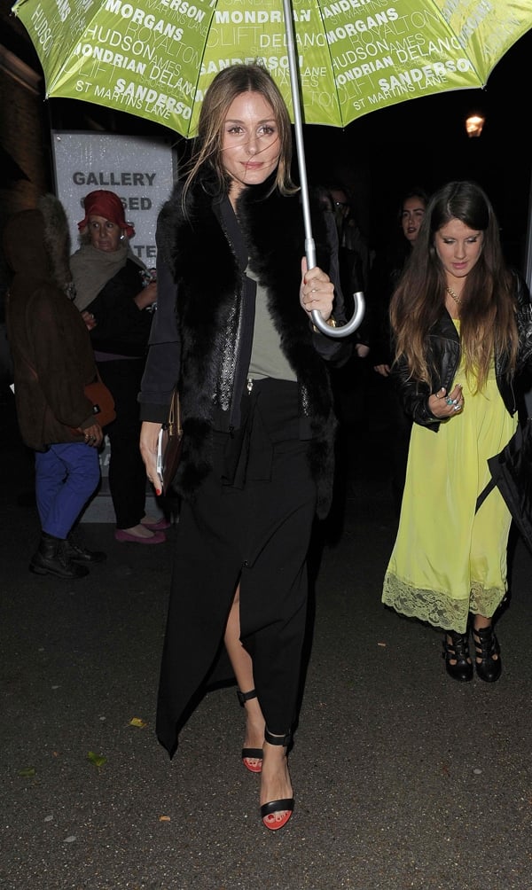 Olivia Palermo attended the Emilia Wickstead Spring 2014 Fashion Show on September 15, 2013, wearing a Rachel Zoe jacket and Tibi Carine ankle strap sandals