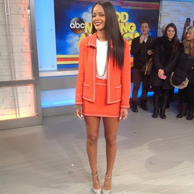 Good Morning America captured Rihanna turning heads on January 29, 2014, in a bold vintage Chanel skirt suit and sleek gray Manolo Blahnik "BB" ankle-strap pumps at their New York City studios