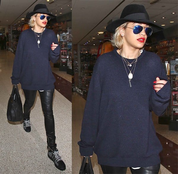 On January 12, 2014, Rita Ora was spotted at LAX airport wearing Ray-Ban original aviator 58mm sunglasses, Balmain biker skinny jeans, and carrying a black Hermes Birkin bag