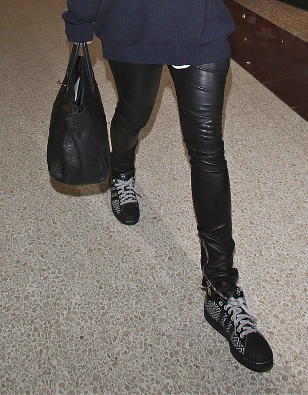 Rita Ora styled her leather pants with sneakers