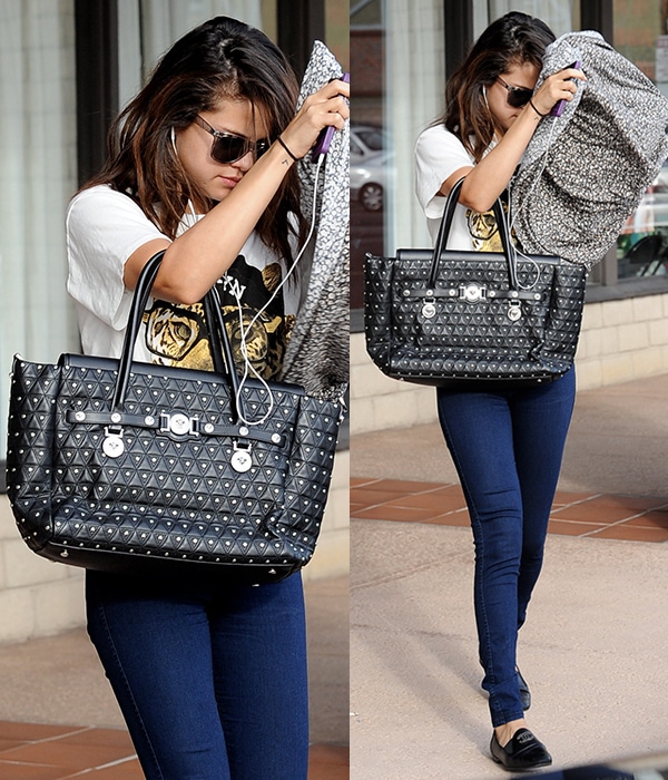 Selena Gomez in American Apparel jeans leaving a tanning salon in Encino