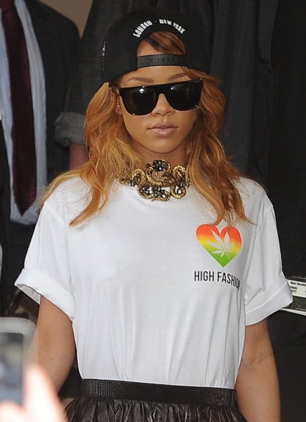 Rihanna spotted in Amsterdam wearing a Silver Spoon high fashion tee, Miu Miu washed-leather mini skirt, and a Trapstar x 40oz Van NYC London New York hat on June 24, 2013