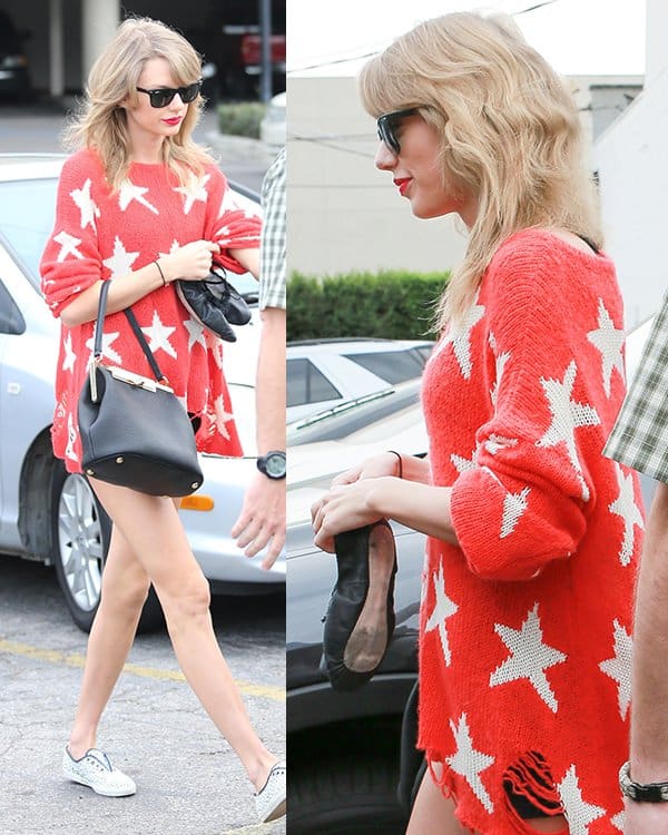Taylor Swift wears a Wildfox red knit sweater with a cream-colored star-pattern design to a ballet dance studio