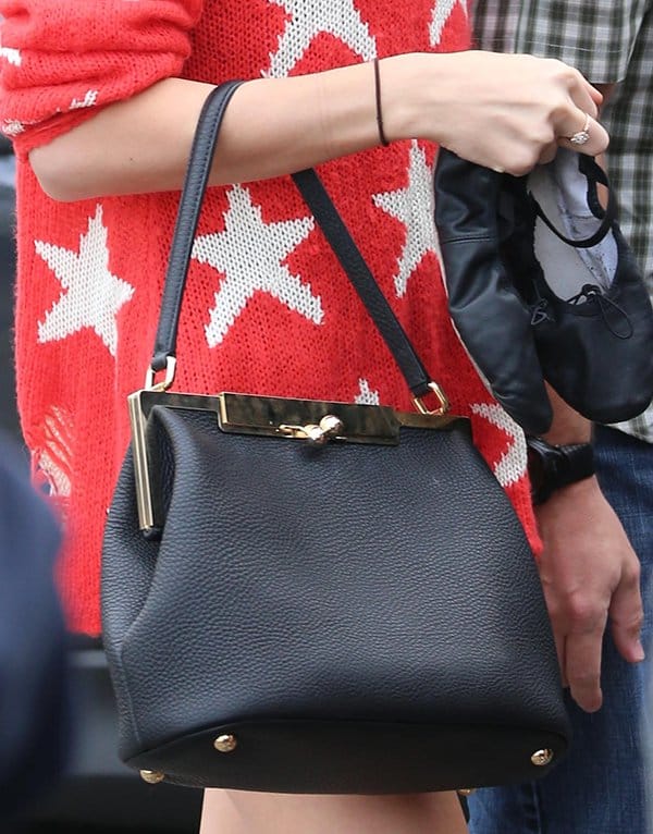 Taylor Swift carrying a Dolce & Gabbana "Sara" shoulder bag, showcasing her love for classy purses