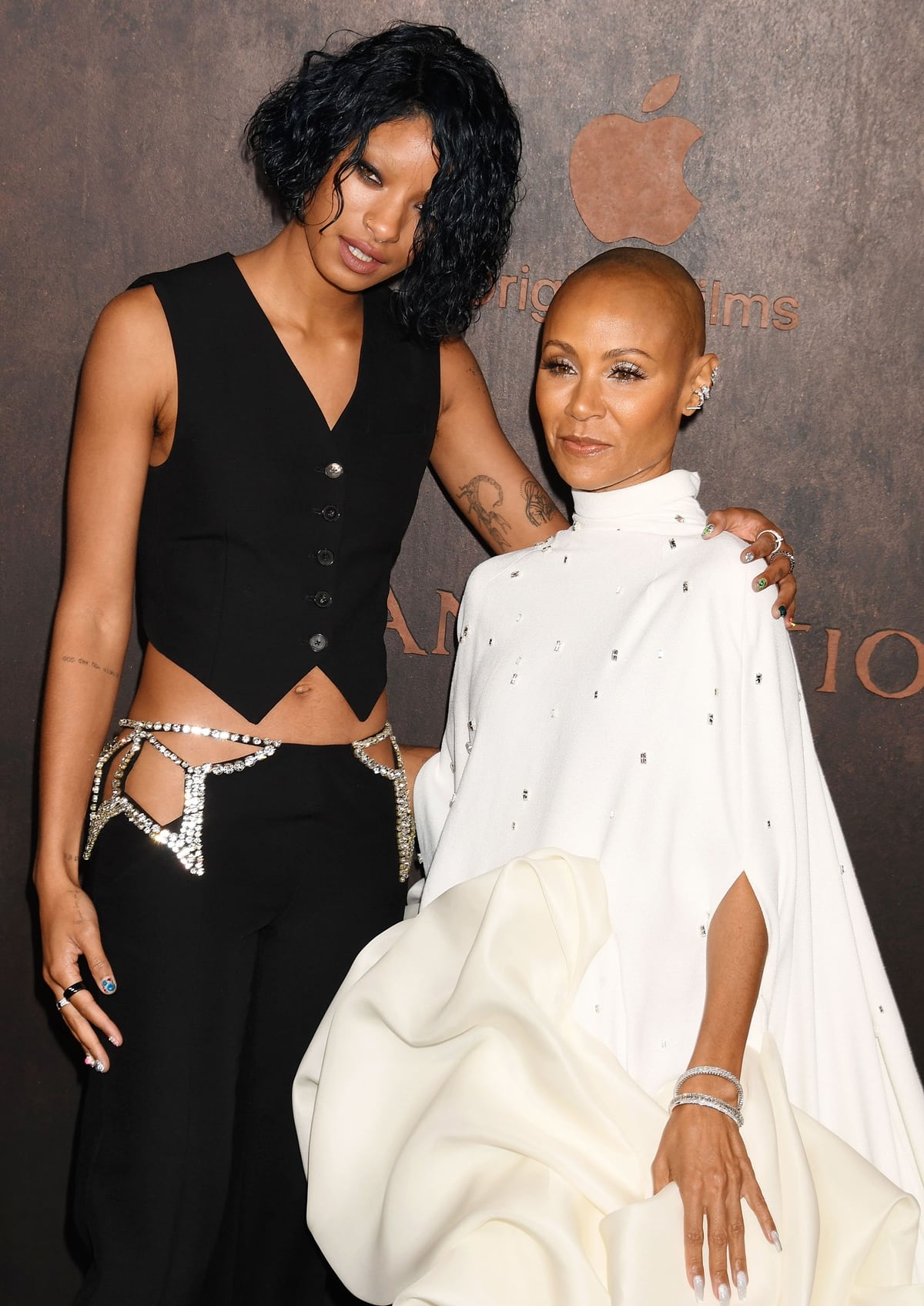 Willow Smith, towering at 5ft 5 inches, alongside her petite mother, Jada Pinkett Smith, at 4ft 11 ½ inches, at the Apple Original Films' "Emancipation" Los Angeles premiere, Regency Village Theatre, November 30, 2022, Los Angeles, California
