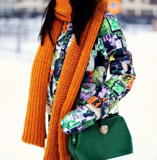 Aibina shows off her stunning orange scarf and green handbag
