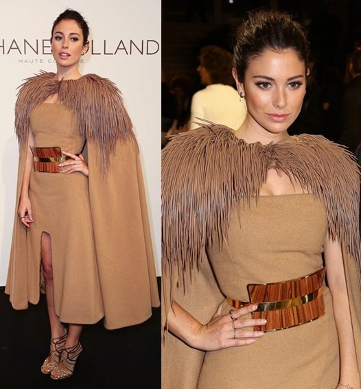 Bianca Suarez rocked a statement cape with her hi-low hemline dress and punctuated the look with gold strappy sandals