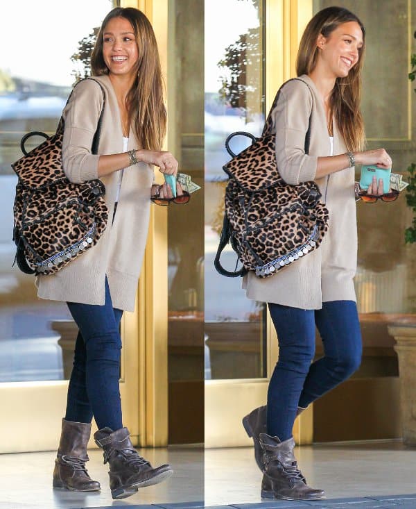 Jessica Alba was spotted at the Sunset Tower Hotel on January 14, 2014, wearing AllSaints Damisi boots in Asphalt, an Inhabit boiled wool cardigan, and carrying a Simone Camille leopard backpack
