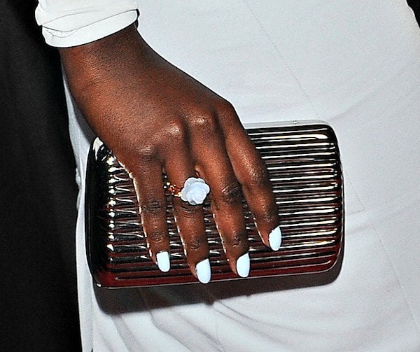 Lupita Nyong'o toting a metallic clutch from Monica Rich Kosann