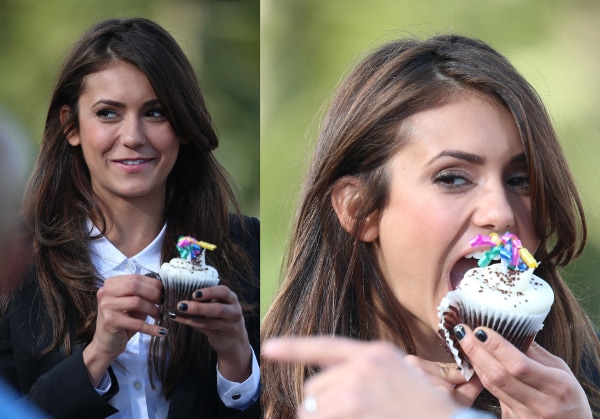 Nina Dobrev enjoys a birthday cupcake on the set of 'Extra,' celebrating her 25th birthday