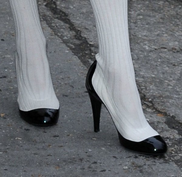 Tilda Swinton wearing color-blocked pump-boot hybrids