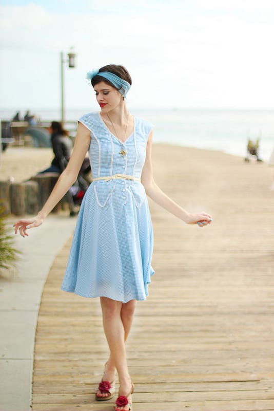 Alexandra adds a pop of color to her vintage frock with red heels