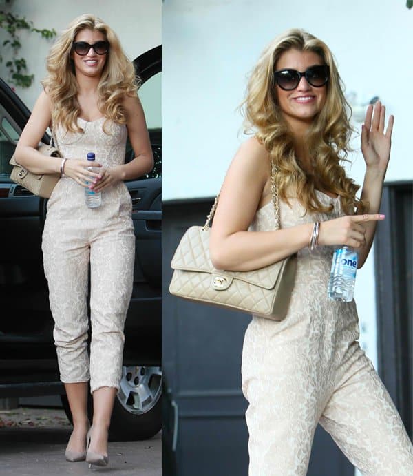 Wearing a white floral print jumpsuit, Amy Willerton stops by a friend's house in West Hollywood
