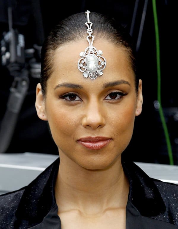 Alicia Keys wearing a bejeweled headdress at the Chanel Ready-To-Wear Fall/Winter 2012 show