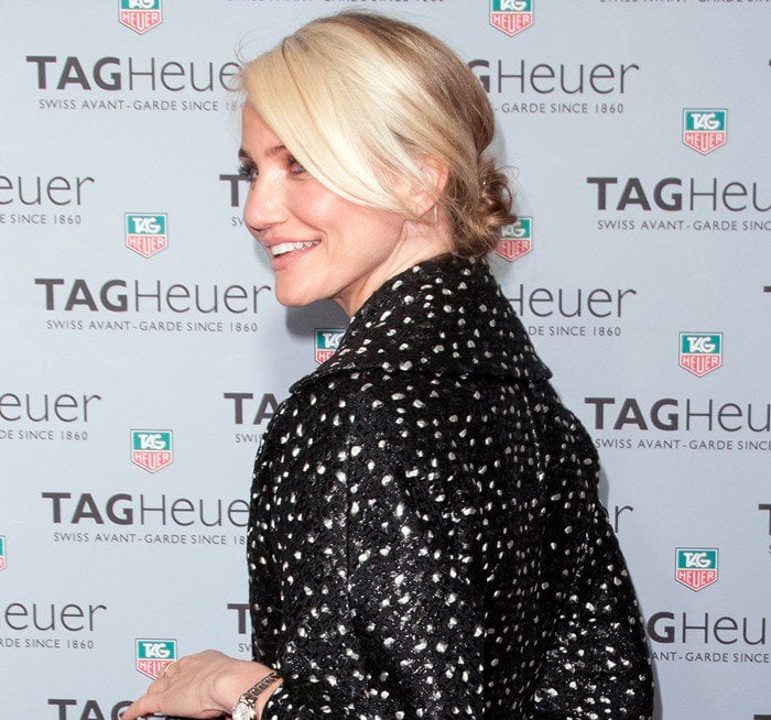 Cameron Diaz wears her hair in a messy bun at the opening of Tag Heuer's first flagship store in New York City