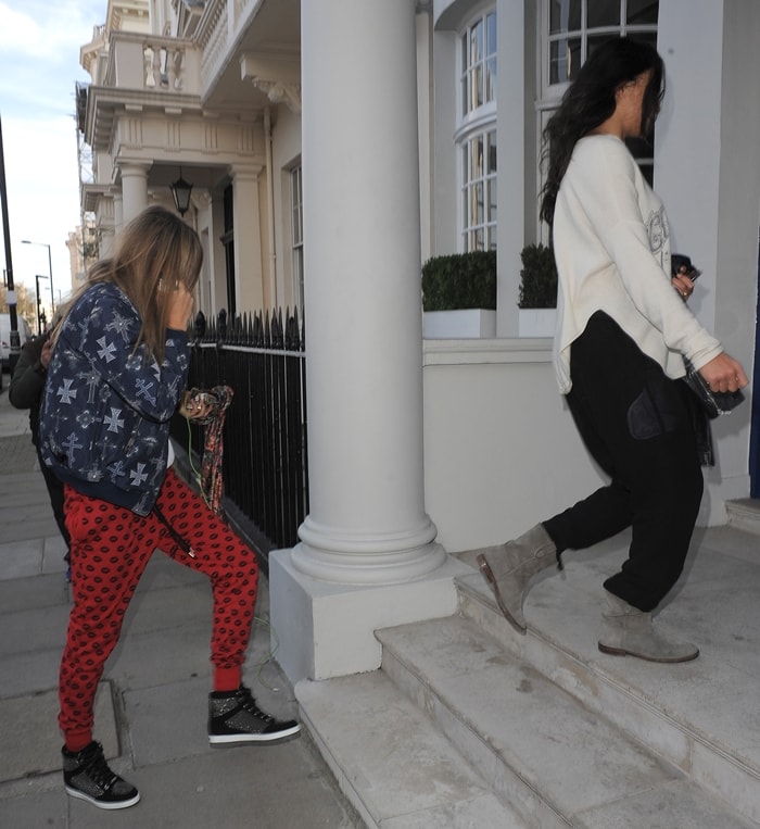 Cara Delevingne and Michelle Rodriguez arrive home together in London on March 6, 2014