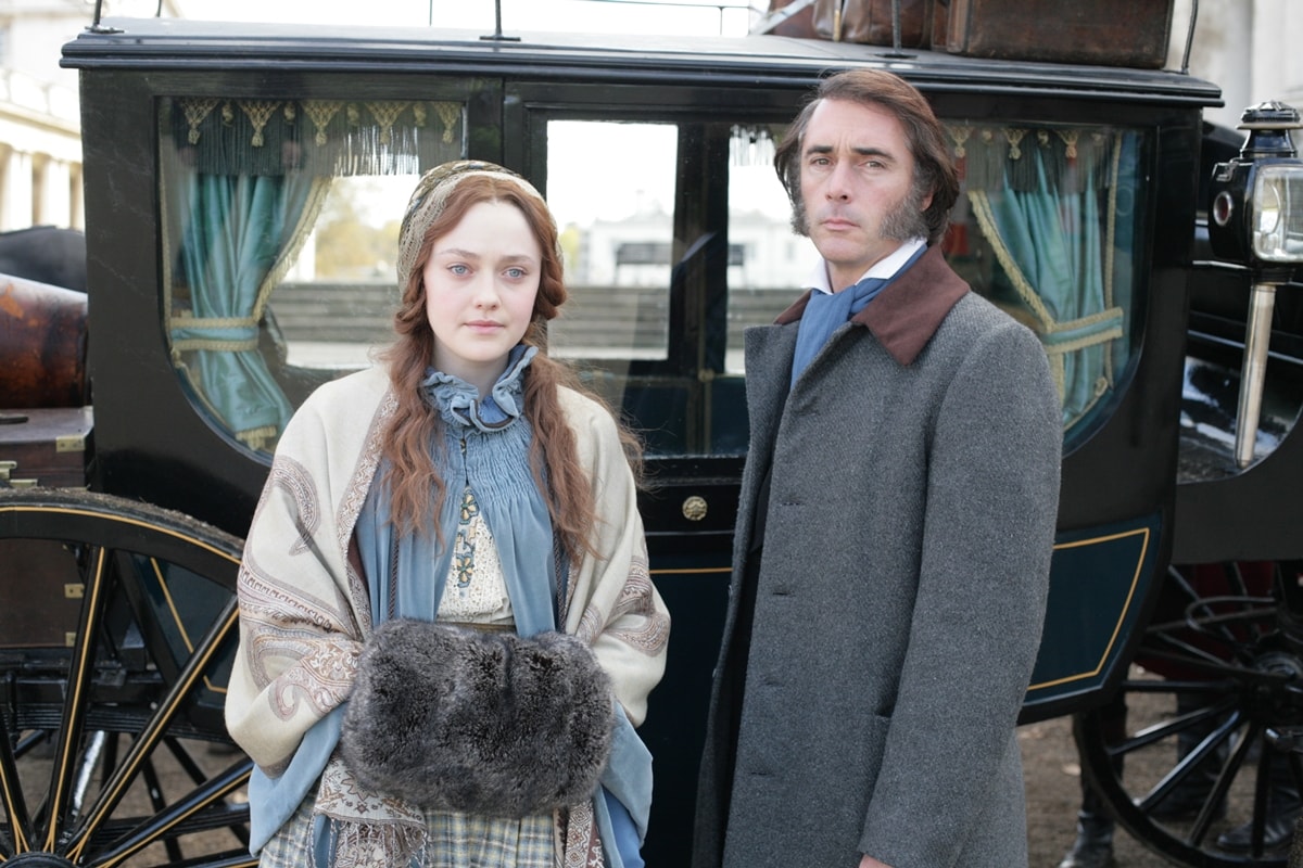 Dakota Fanning as teenage bride Euphemia "Effie" Gray and Greg Wise as John Ruskin in the 2014 British biographical film Effie Gray