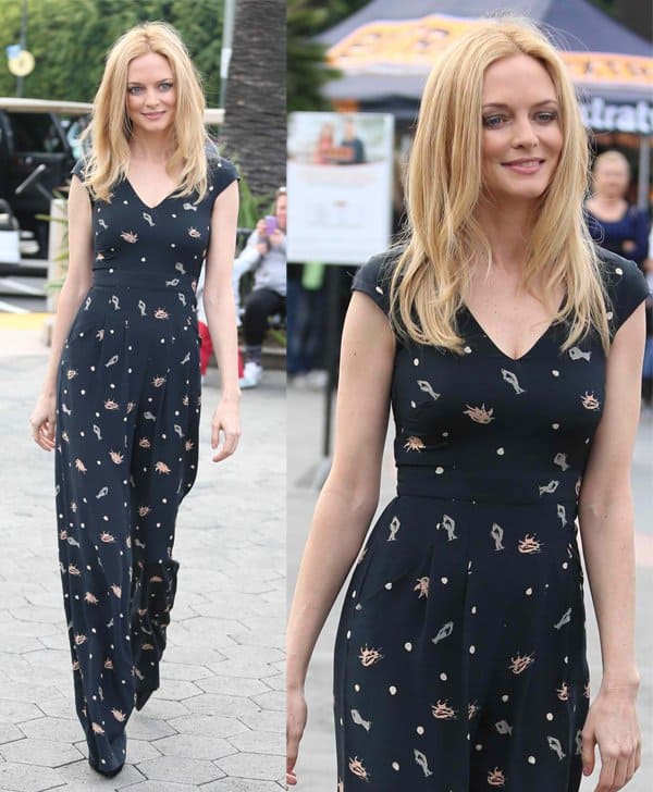 Heather Graham channels 70's vibes in a loose bottom jumpsuit on Extra, adding volume and curves for a sexy silhouette
