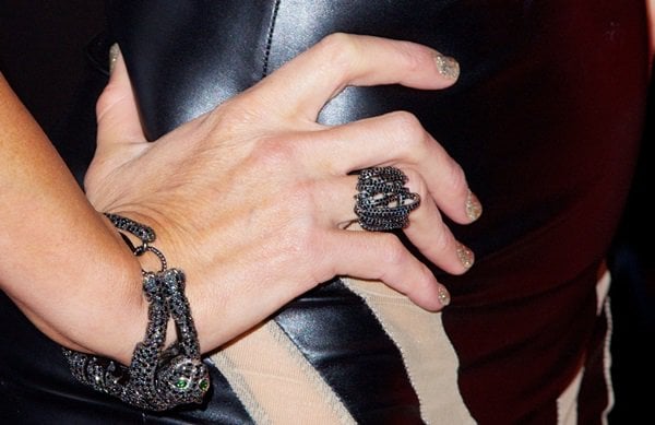 Paris Hilton accessorizes with a ring and bracelet