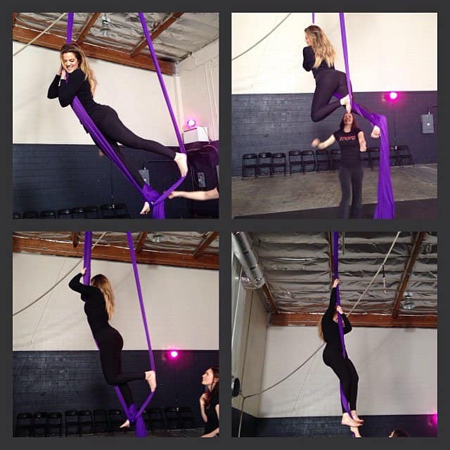 Khloe and Kourtney Kardashian trying out a new aerial workout