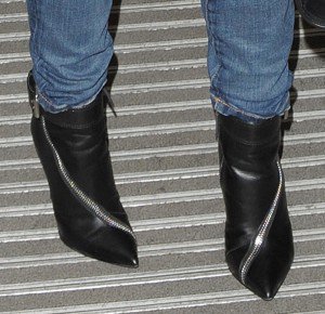 Kylie Minogue With Blonde Curly Hair in Jeans & Black Zip Boots
