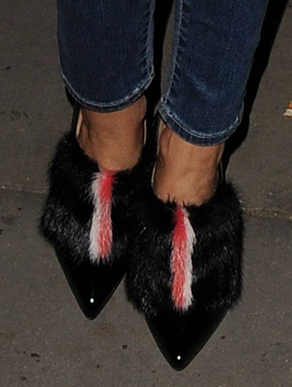 Olivia Palermo wears a pair of Fendi fur-trimmed booties on her feet