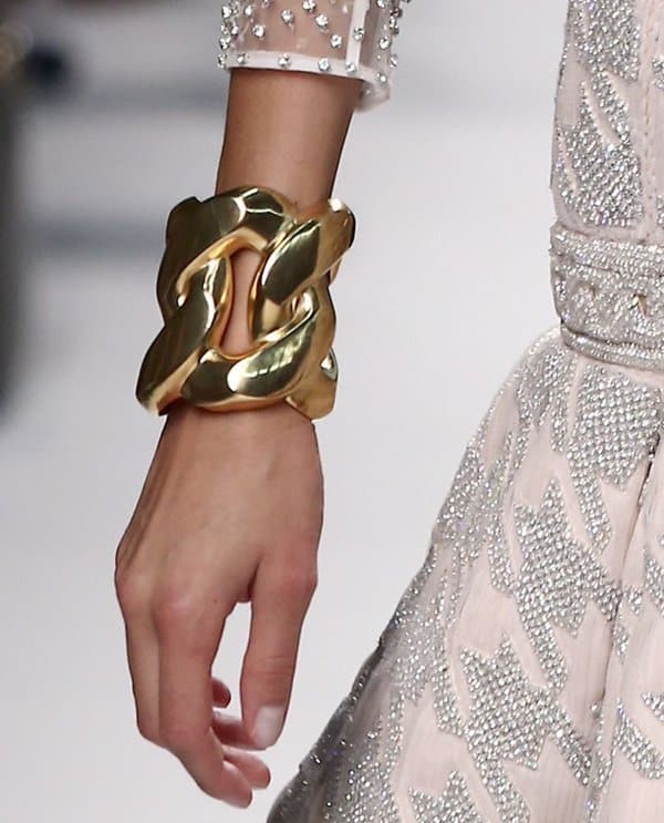 A model wears an oversized bracelet at the Lanvin Spring/Summer 2014 fashion show
