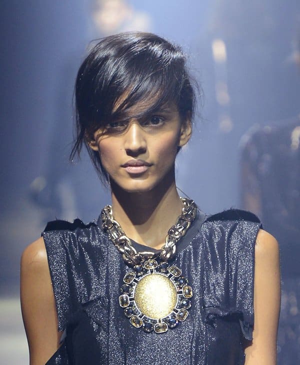 A model wears an oversized necklace at the Lanvin Spring/Summer 2014 fashion show