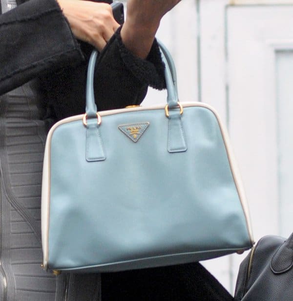 Petra Nemcova totes a pastel blue Prada Pyramid tote