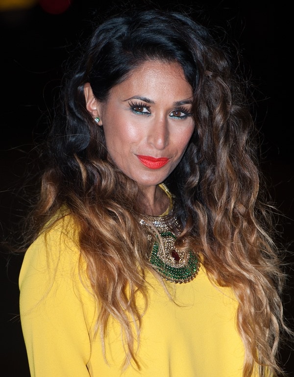 Preeya Kalidas looked stunning with voluminous, cascading curls and a bold red lip, perfectly complementing her statement necklace and vibrant yellow dress