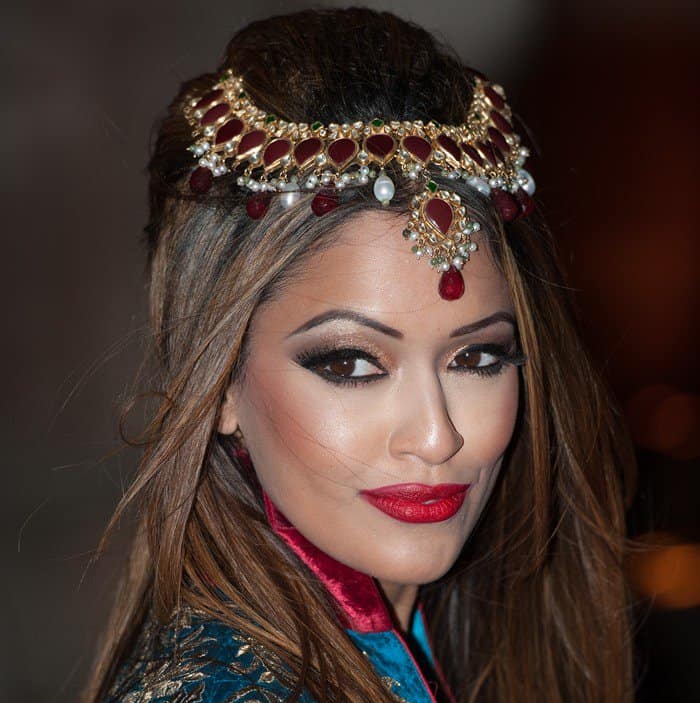 Tasmin Lucia-Khan dazzles in a bejeweled headpiece at the British Asian Trust Party