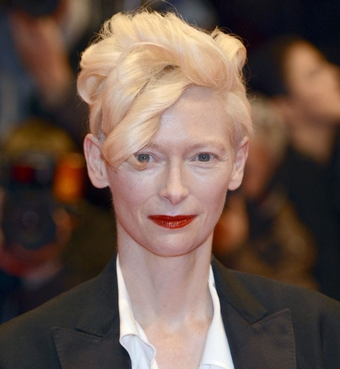 Tilda Swinton wears her hair up in an architectural updo