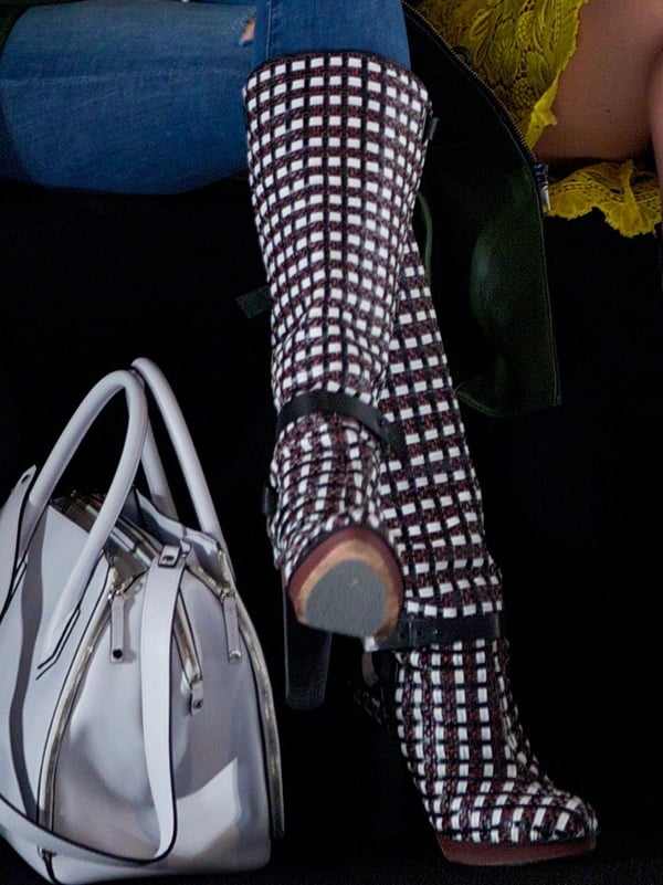 Zendaya Coleman wears grid-printed Rebecca Minkoff boots to the designer's fashion show