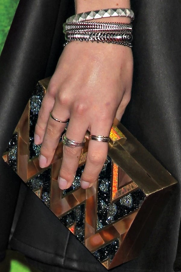 Bella Thorne's black-and-gold embellished clutch from Emm Kuo