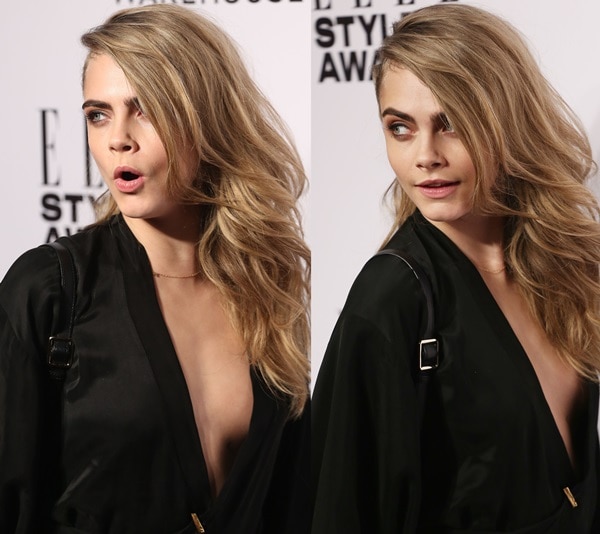 Cara Delevingne in a vintage black gown with a dangerously low neckline