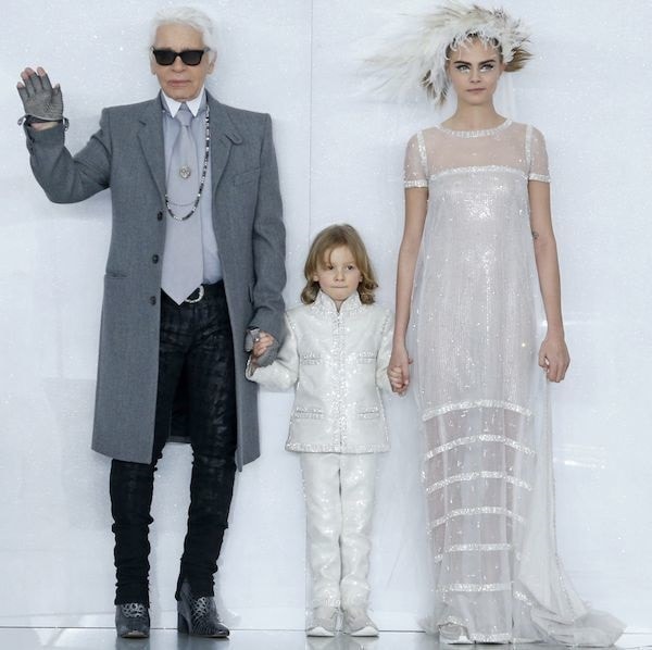 Cara Delevingne with designer Karl Lagerfeld and his godson, Hudson Kroenig, for the Chanel spring/summer 2014 haute couture fashion show finale during Paris Fashion Week held in Paris, France, on January 21, 2014