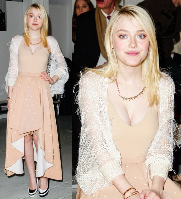 Dakota Fanning wears her blonde hair down and shows off her cleavage at the Rodarte presentation
