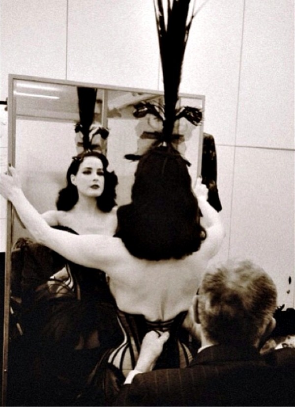 Dita Von Teese's Instagram photo with the caption, "Being laced in by Mr. Pearl for a showgirl-butterfly moment at Jean-Paul Gaultier Haute Couture in Paris today." - posted on January 23, 2014