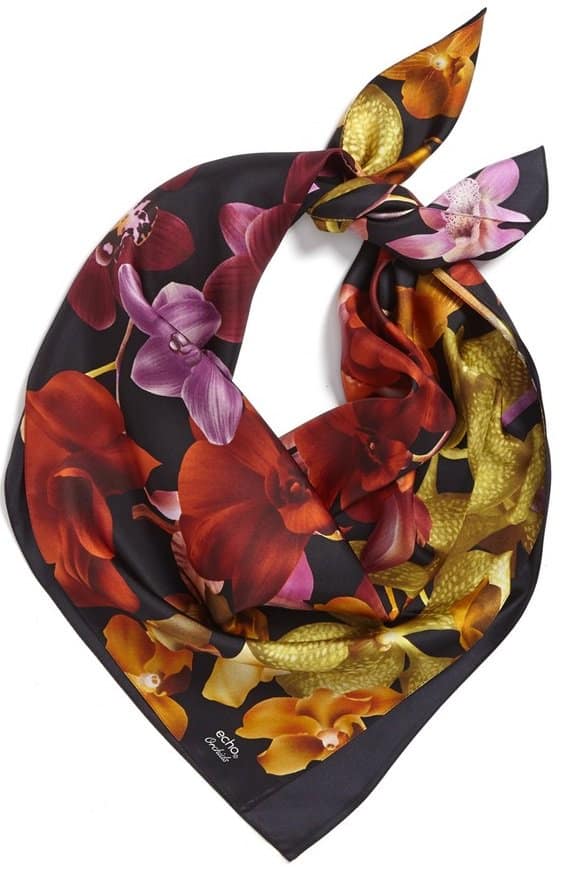A vivacious floral print lends a breezy, tropical vibe to a sophisticated silk scarf