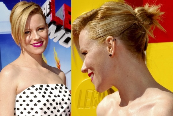 Elizabeth Banks' hair was swept to one side and styled in a messy bun to show off her ear cuff from Jack Vartanian