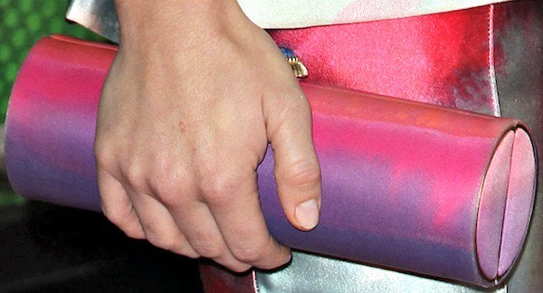 Holland Roden carried a hand-painted roll clutch from Amanda Pearl
