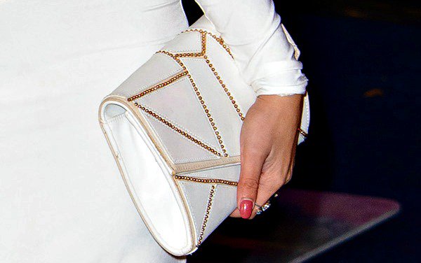 Jasmin Walia totes  a white clutch