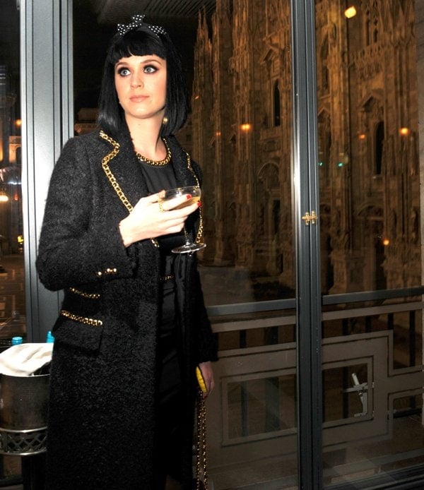 Katy Perry in a black-and-gold Moschino ensemble