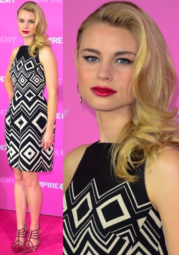 Lucy Fry styles her hair in retro glam waves at the premiere of "Vampire Academy"