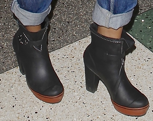 Selena Gomez in super chic Sorel rain ankle boots