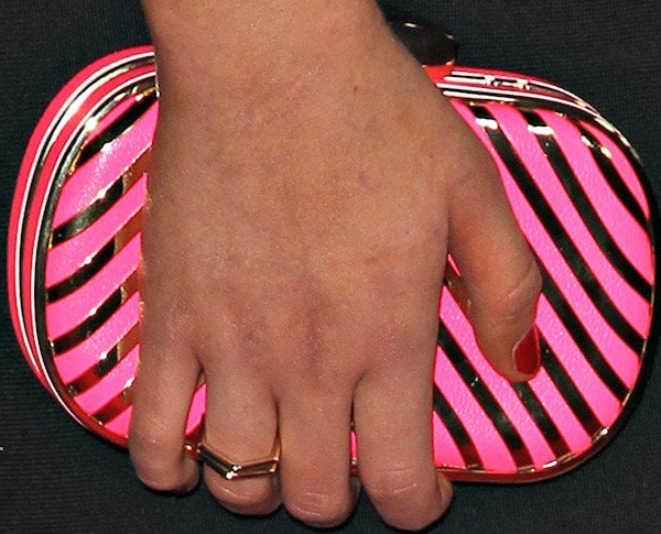 Stefanie Scott toting a hot pink clutch