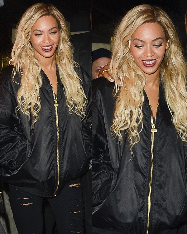 Beyonce styled her torn Frame Denim jeans with a puffy bomber jacket