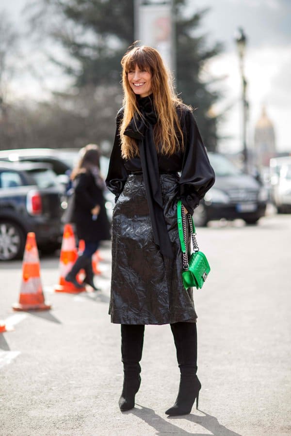 Caroline de Maigret in an all-black outfit with a crumpled skirt